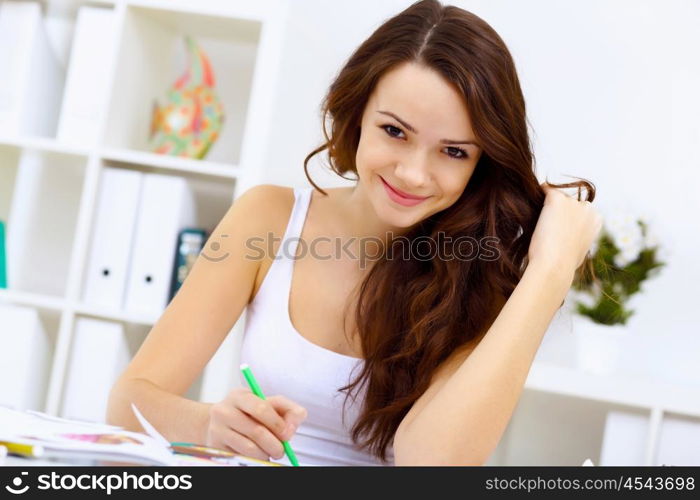 Student girl studying her lessons at home