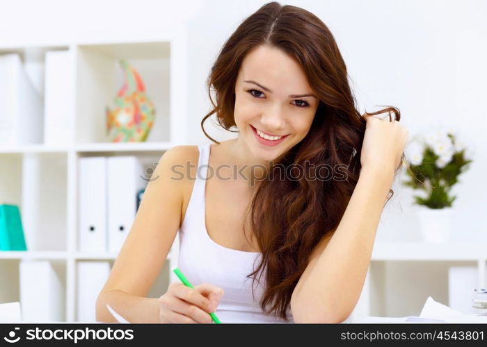 Student girl studying her lessons at home