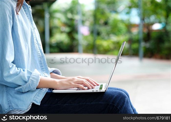 Student girl using laptop computer, online education, adult learning concept