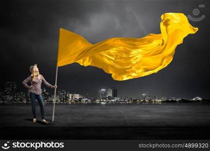 Student girl waving flag. Young girl in casual with blank waving flag in hand