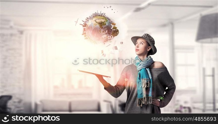 Student girl with book in hands. Young hipster girl with opened book in hands. Elements of this image are furnished by NASA