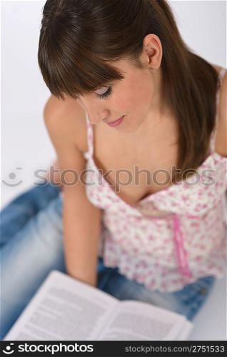 Student - Happy female teenager read book