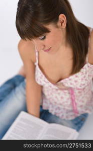 Student - Happy female teenager read book