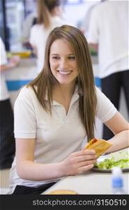 Student having lunch in dining hall