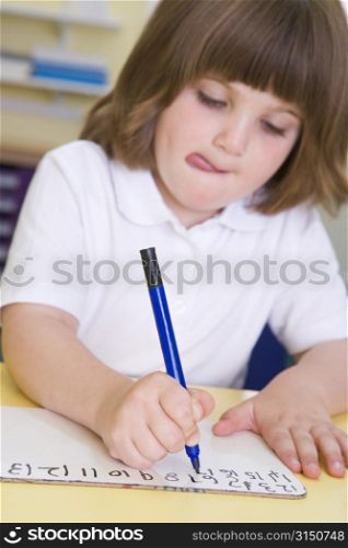 Student in class learning numbers (selective focus)