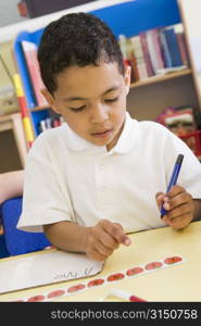 Student in class learning numbers (selective focus)