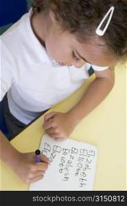 Student in class learning spelling (selective focus)
