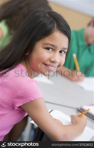 Student in class looking at camera (selective focus)