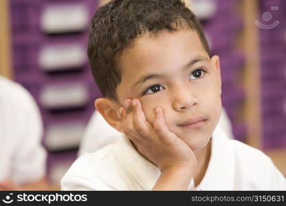 Student in class sitting on floor bored (selective focus)