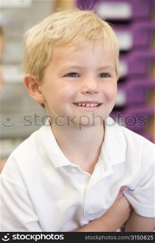 Student in class smiling (selective focus)