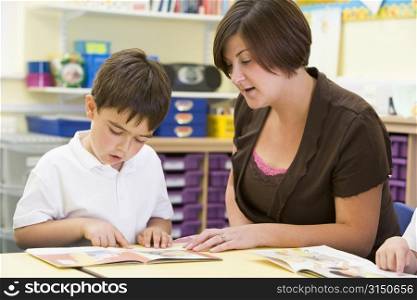 Student in class with teacher reading