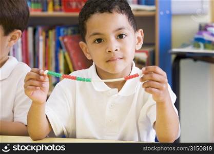 Student in math class with counting beads