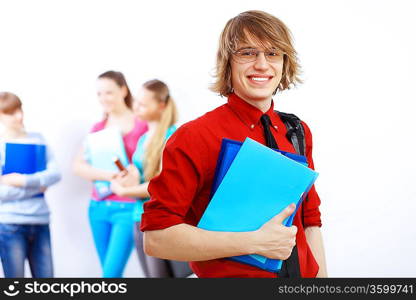 Student in red shirt wearing glasses and with books