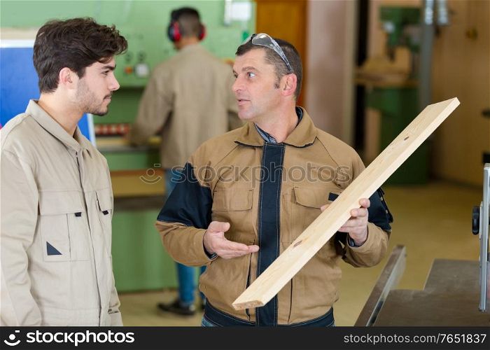student in woodwork training course with professional