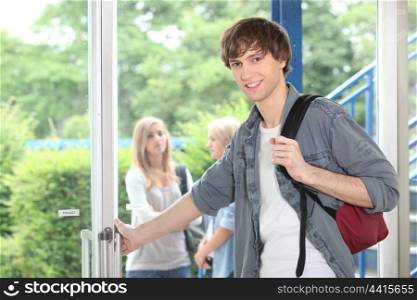 Student leaving through door
