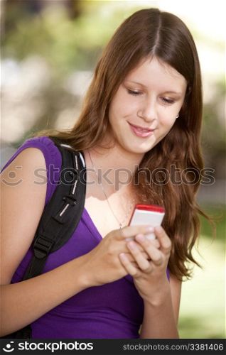Student looking at cell phone and texting