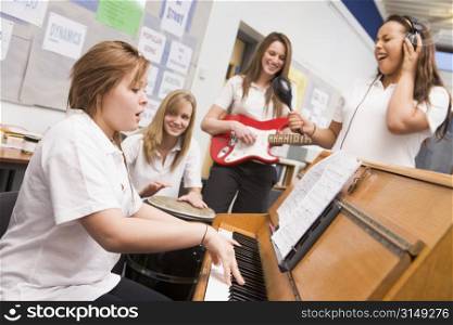 Student musicians practising in classroom