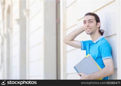Student outside preparing for exams
