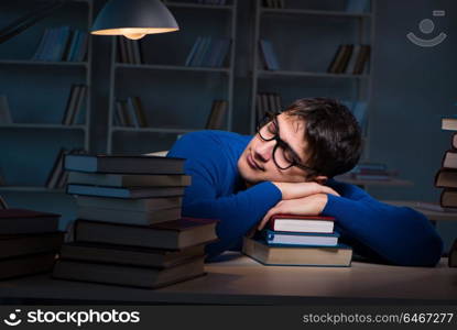 Student preparing for exams late at night in library