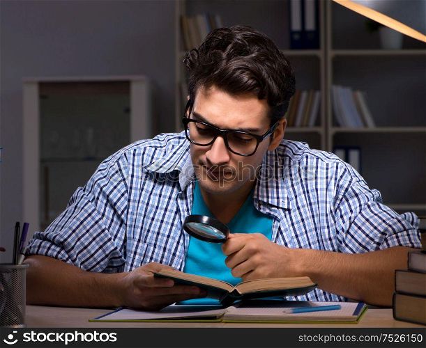 Student preparing for exams late night at home. The student preparing for exams late night at home