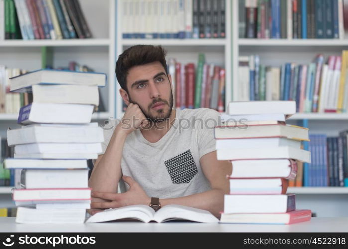 Student reading book in school library. Study lessons for exam. Hard worker and persistance concept.