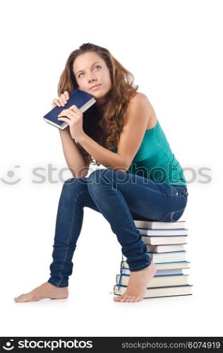 Student sitting on stack of books