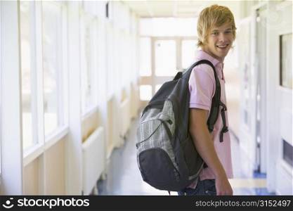 Student standing in corridor (selective focus)