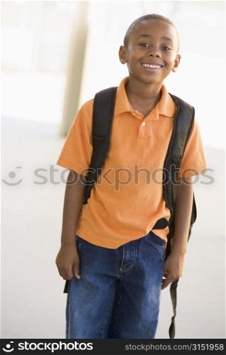 Student standing outdoors smiling (high key)