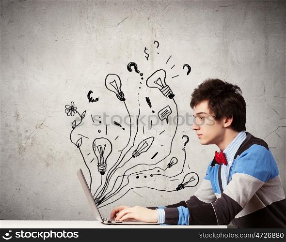 Student studying. Young thoughtful man using laptop. Idea concept