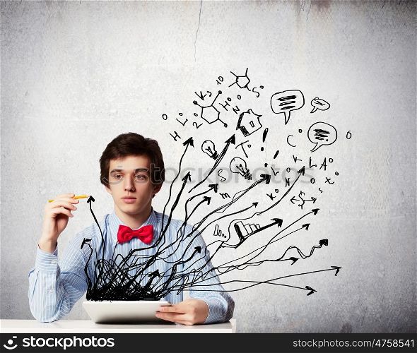 Student studying. Young thoughtful man using laptop. Idea concept