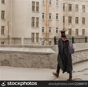 student walking graduation ceremony