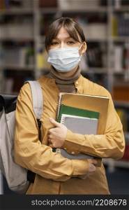 student wearing medical masks library