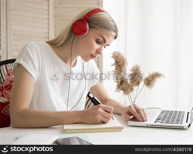 student wearing red headphones e learning concept