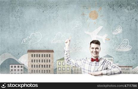 Student with banner. Young man with white blank banner. Place for text