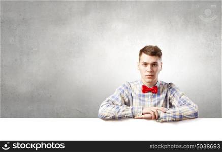 Student with banner. Young man with white blank banner. Place for text