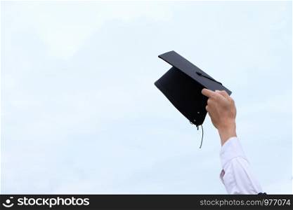 Student with congratulations, graduates wearing a graduation gown of university
