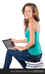 Student with netbook sitting on books