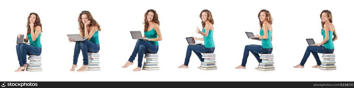 Student with netbook sitting on books