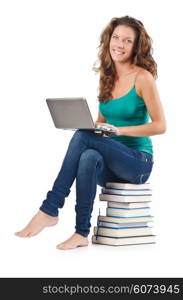 Student with netbook sitting on books