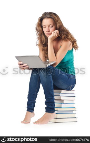 Student with netbook sitting on books