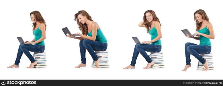 Student with netbook sitting on books