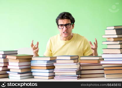 Student with too many books to read before exam