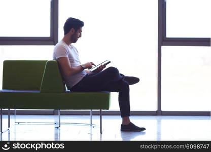 student working on tablet computer at university school modern interior