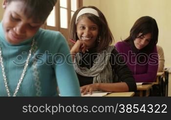 Students and high school education, portrait of happy black young woman smiling during exam