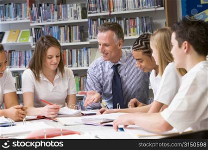 Students and teacher in a study group collaborating