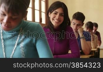 Students and university education, portrait of hispanic woman during test at college