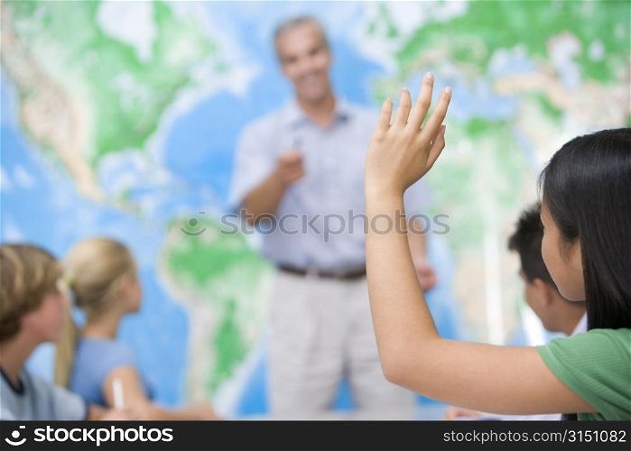 Students answering questions in geography class