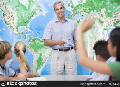 Students answering questions in geography class
