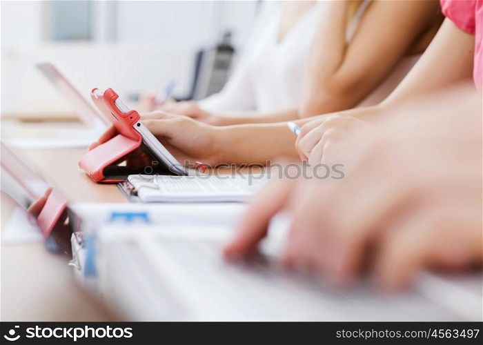Students at lecture. Close up image of young people using laptop at classroom
