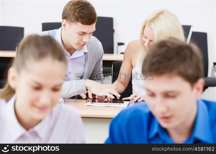 Students at lecture. Young people sitting in classroom at lesson